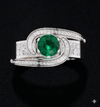 ELEGANT SWIRL EMERALD SOLITAIRE RING
